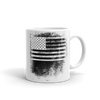 coffee mug with black and white American flag image smeared in a fingerprint