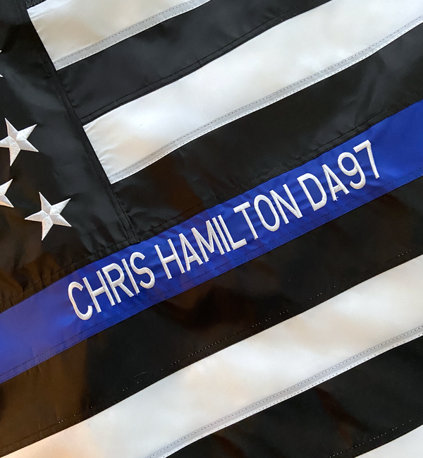 Officer's name embroidered on the blue stripe of a custom Thin Blue Line flag