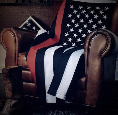 3x5 foot nylon firefighter flag resting on leather chair